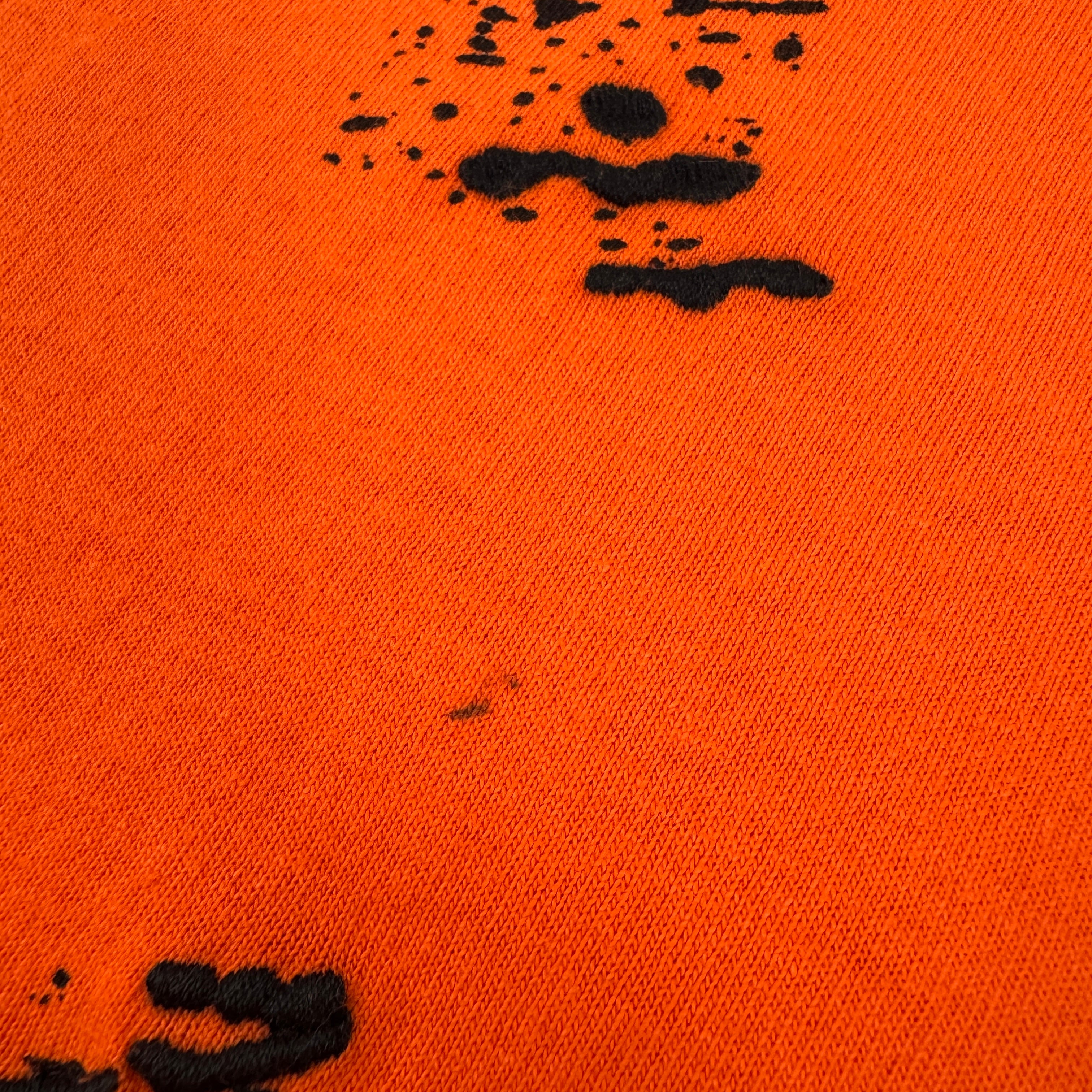 Bright orange oversized tee featuring a subtle Off White logo print on the chest and arrow detailing on the back. Made from