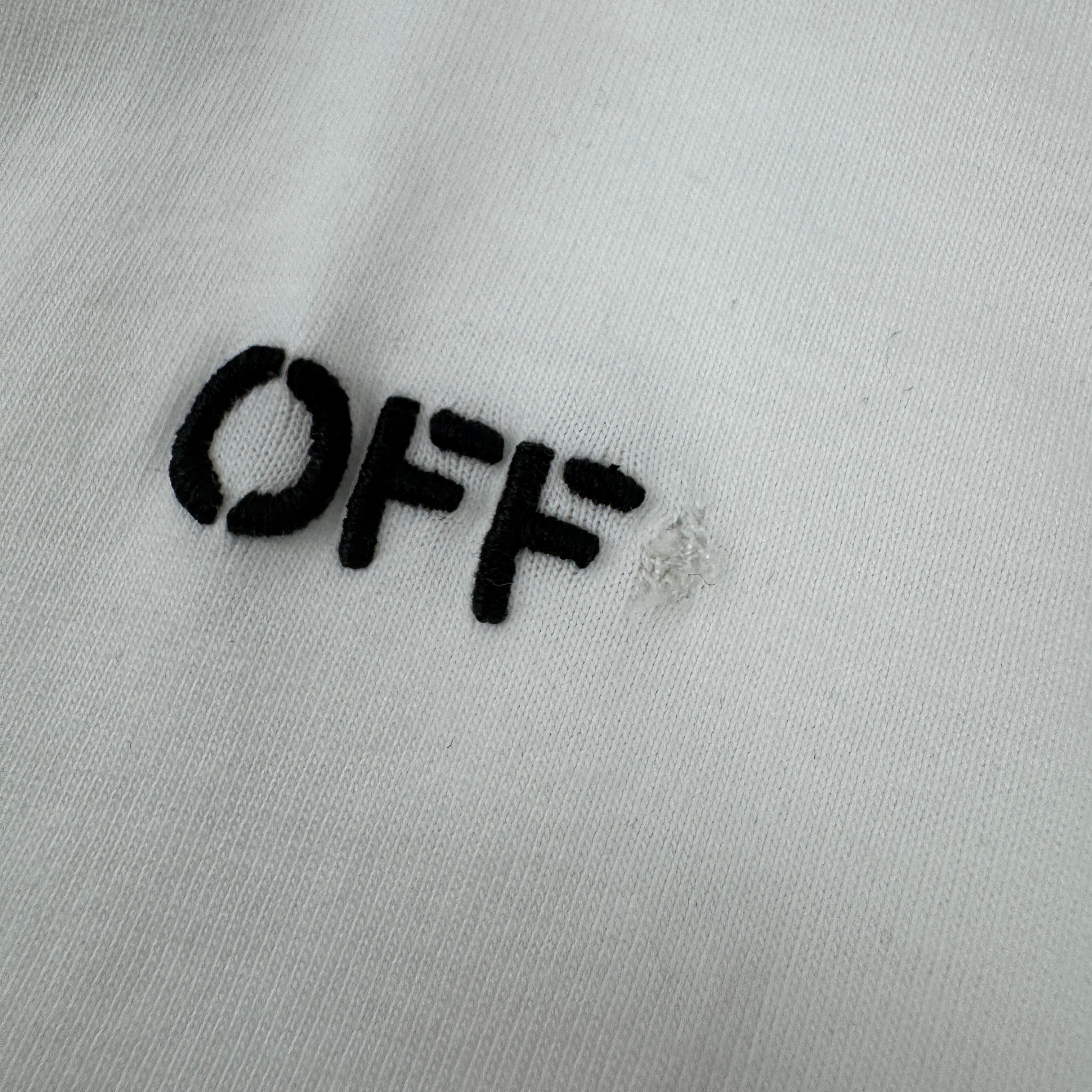 Off White tee in white featuring a classic cherub graphic and signature branded details. A stylish designer streetwear piece