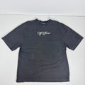 Off white tee features a heavyweight cotton construction with a vintage, washed black finish. The front displays a clean,