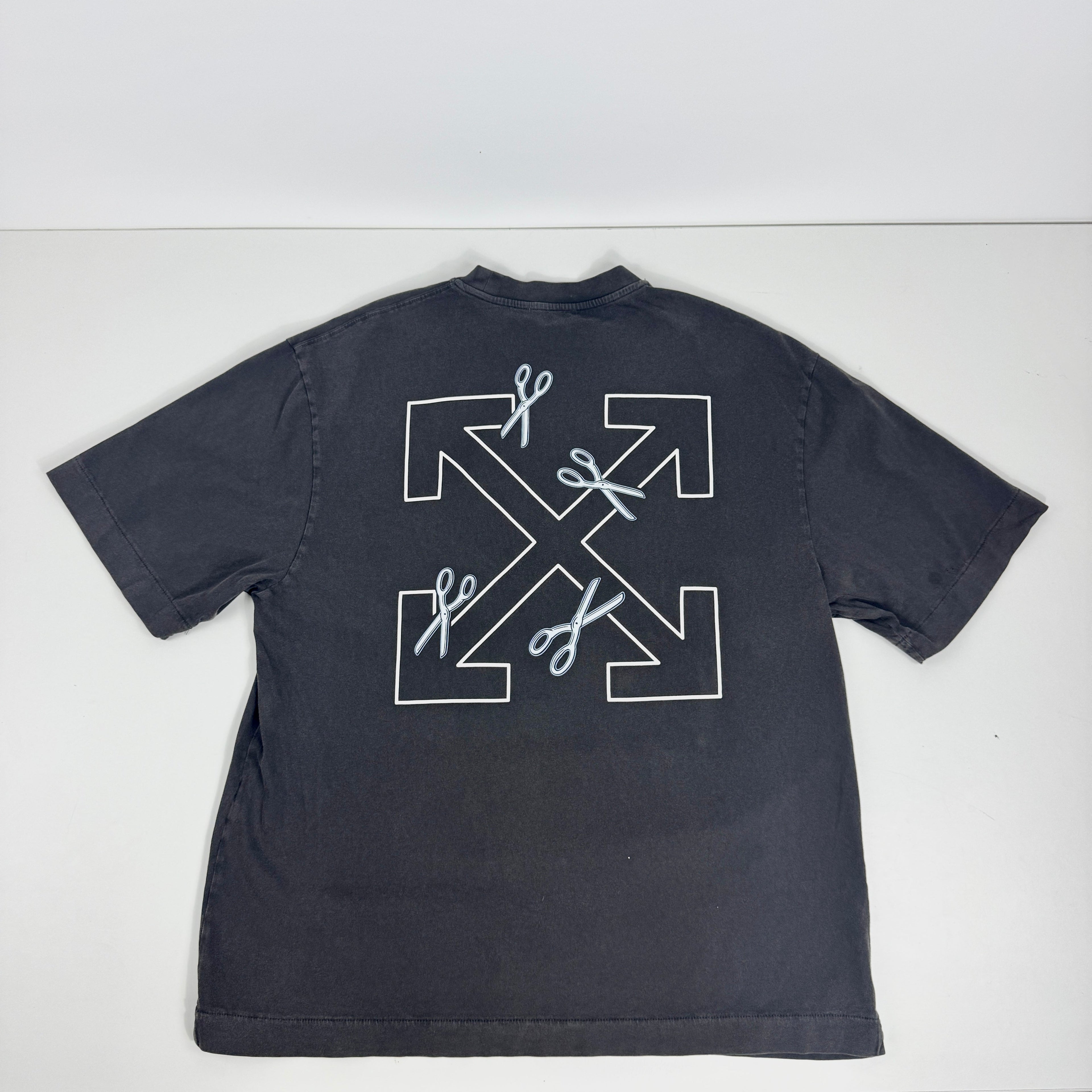 Off white tee features a heavyweight cotton construction with a vintage, washed black finish. The front displays a clean,