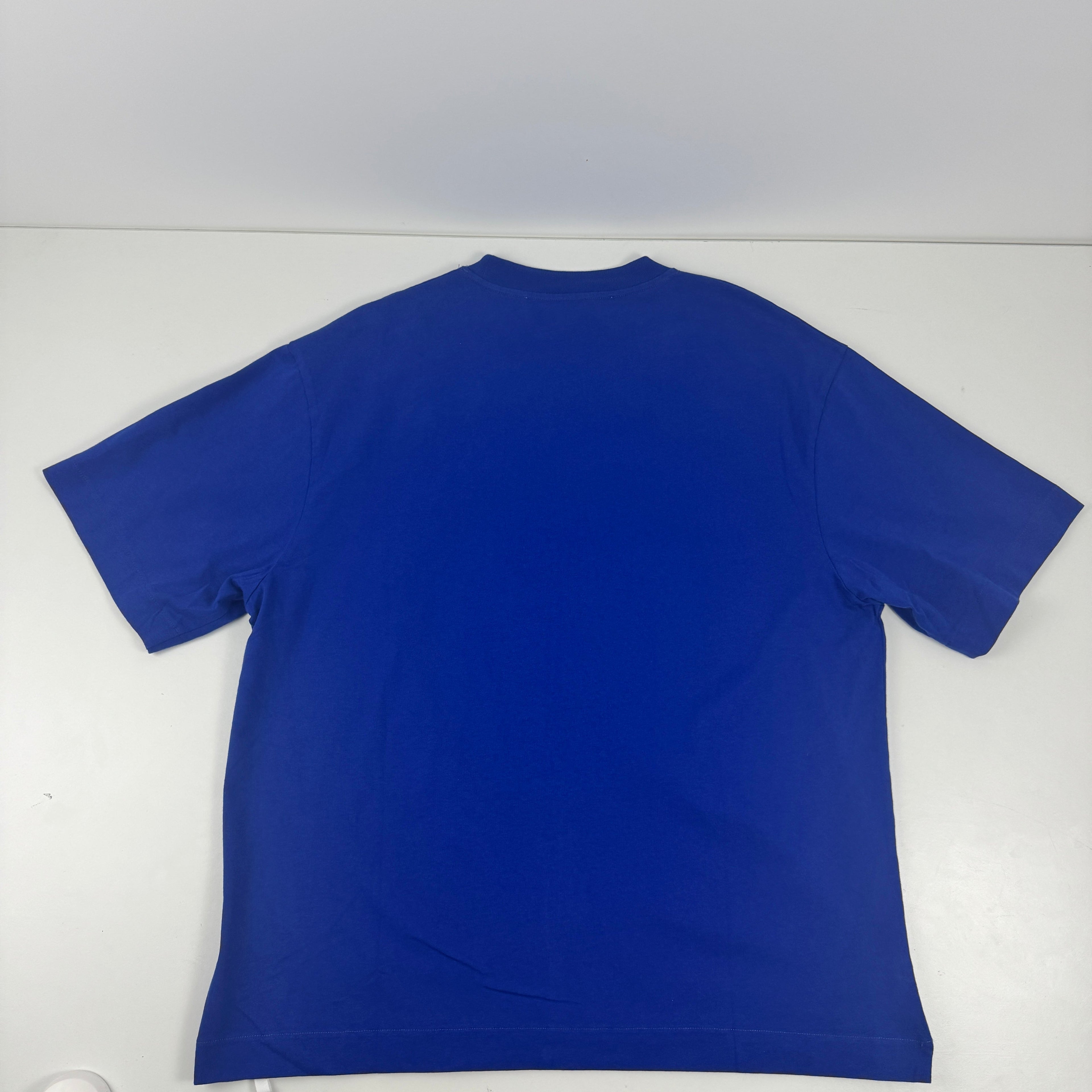 This Off-White tee features a subtle embroidered style tonal logo on a striking blue colour. Perfect for layering and