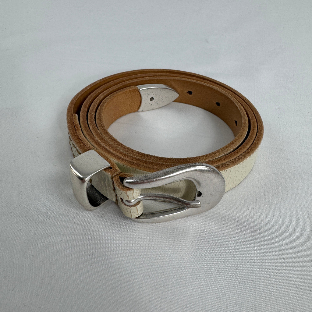 The Our Legacy White Belt Cracked is a premium leather belt crafted from cracked-finish leather for a distinctive worn-in