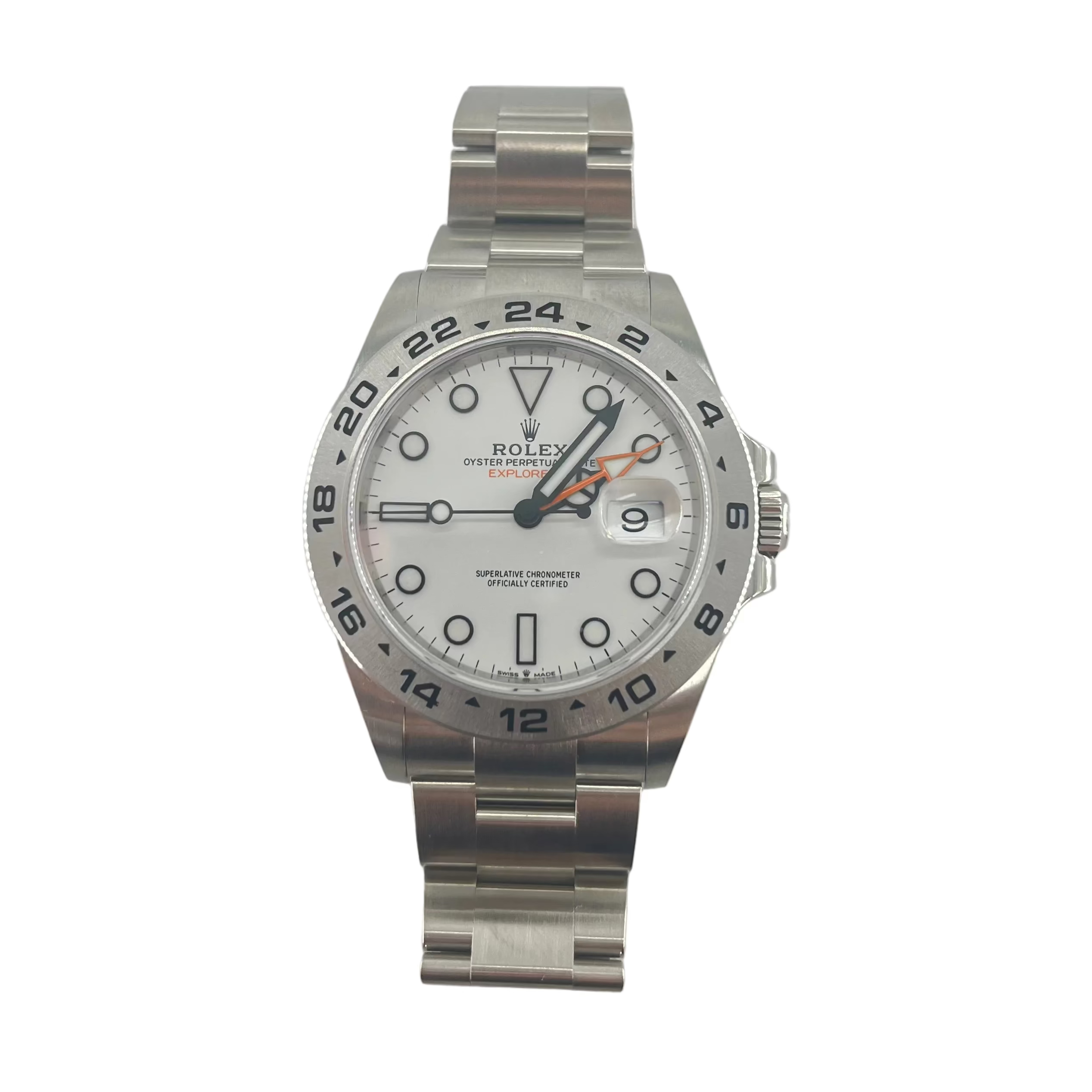 Rolex Explorer II silver wristwatch with a white dial, black markers and hands, orange GMT hand, date window, and metal link bracelet.
