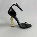 The Saint Laurent Opyum 110 is an iconic high-heel sandal renowned for its striking YSL logo heel. Crafted from premium