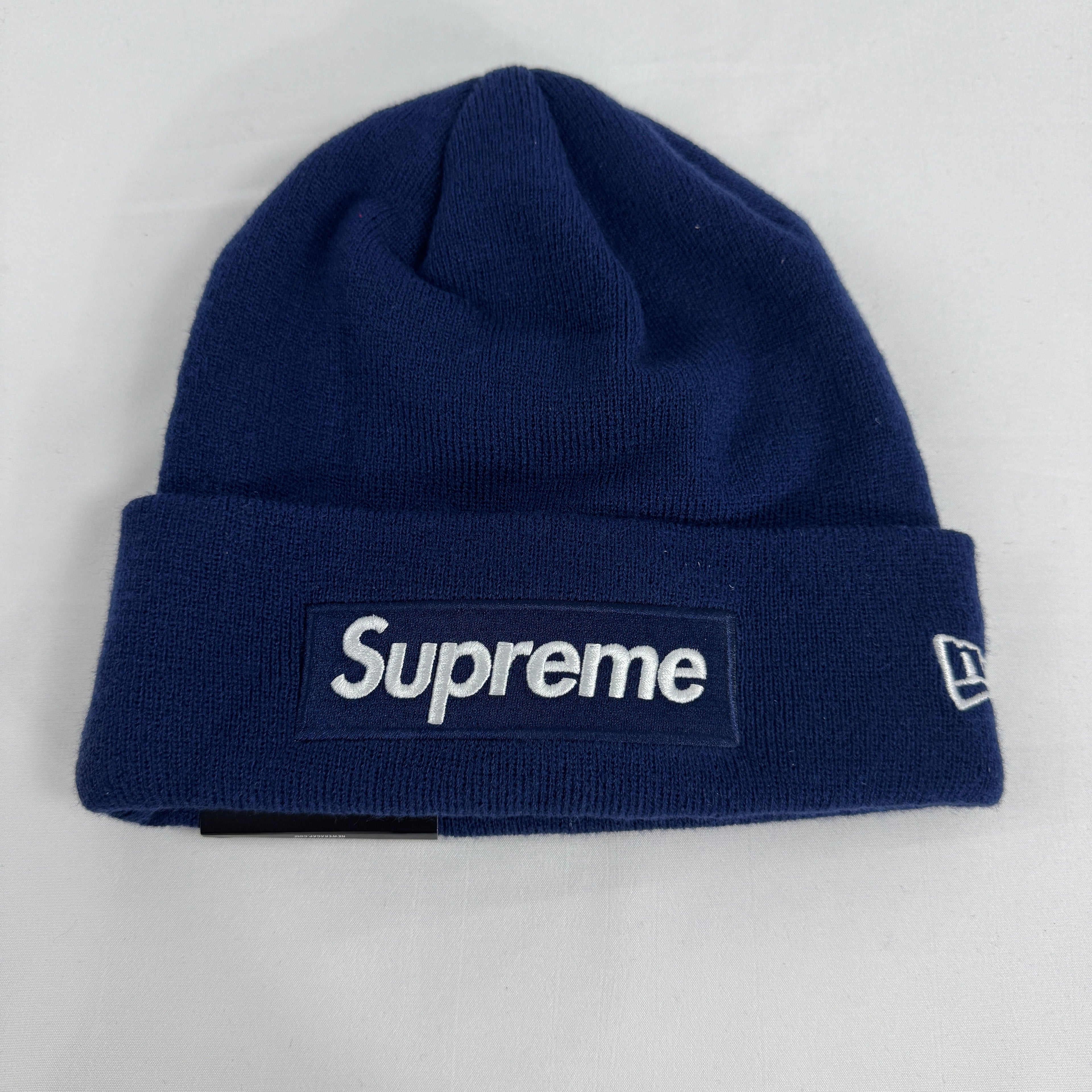 The Supreme Box Logo Beanie Navy is a ribbed knit winter hat featuring the iconic Supreme box logo stitched on the front