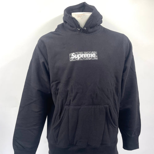 Supreme Box Logo Hoodie in black. Size Medium, patterned logo.