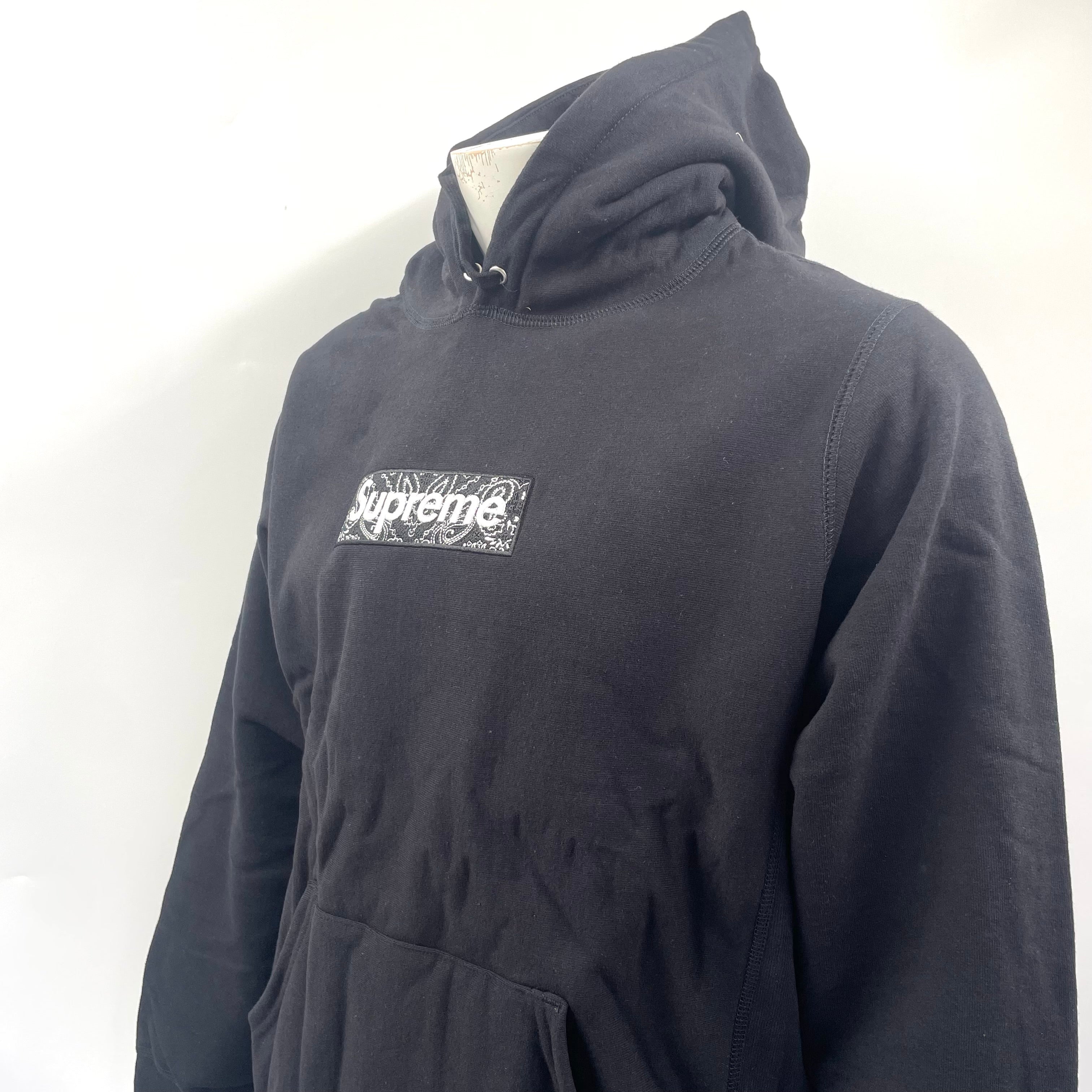 Supreme Box Logo Hoodie in black. Size Medium, patterned logo.