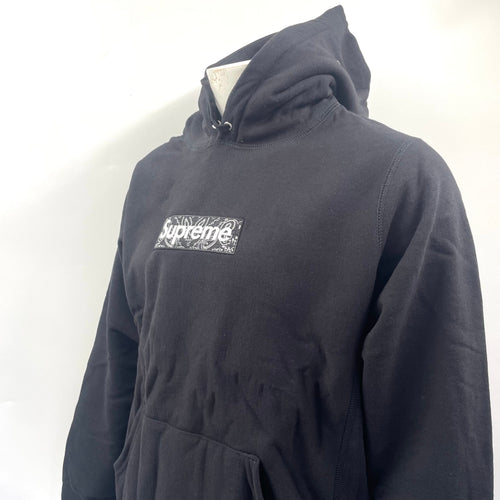 Supreme Box Logo Hoodie in black. Size Medium, patterned logo.
