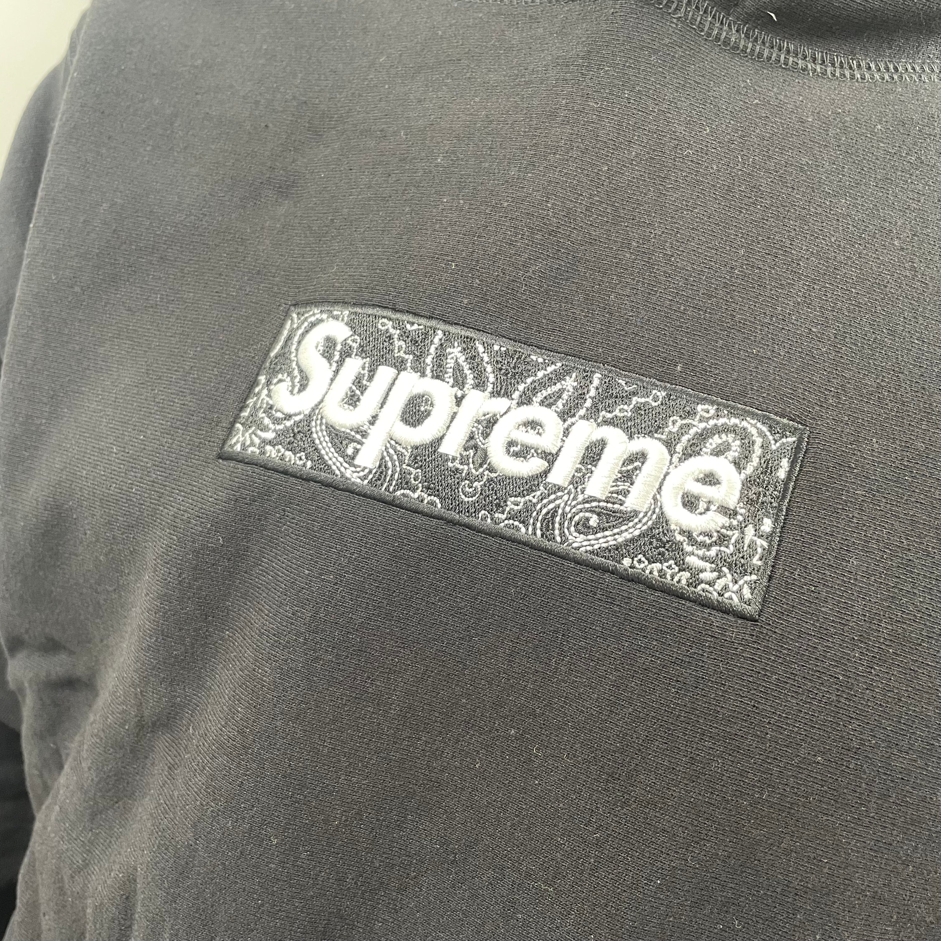 Supreme Box Logo Hoodie in black. Size Medium, patterned logo.
