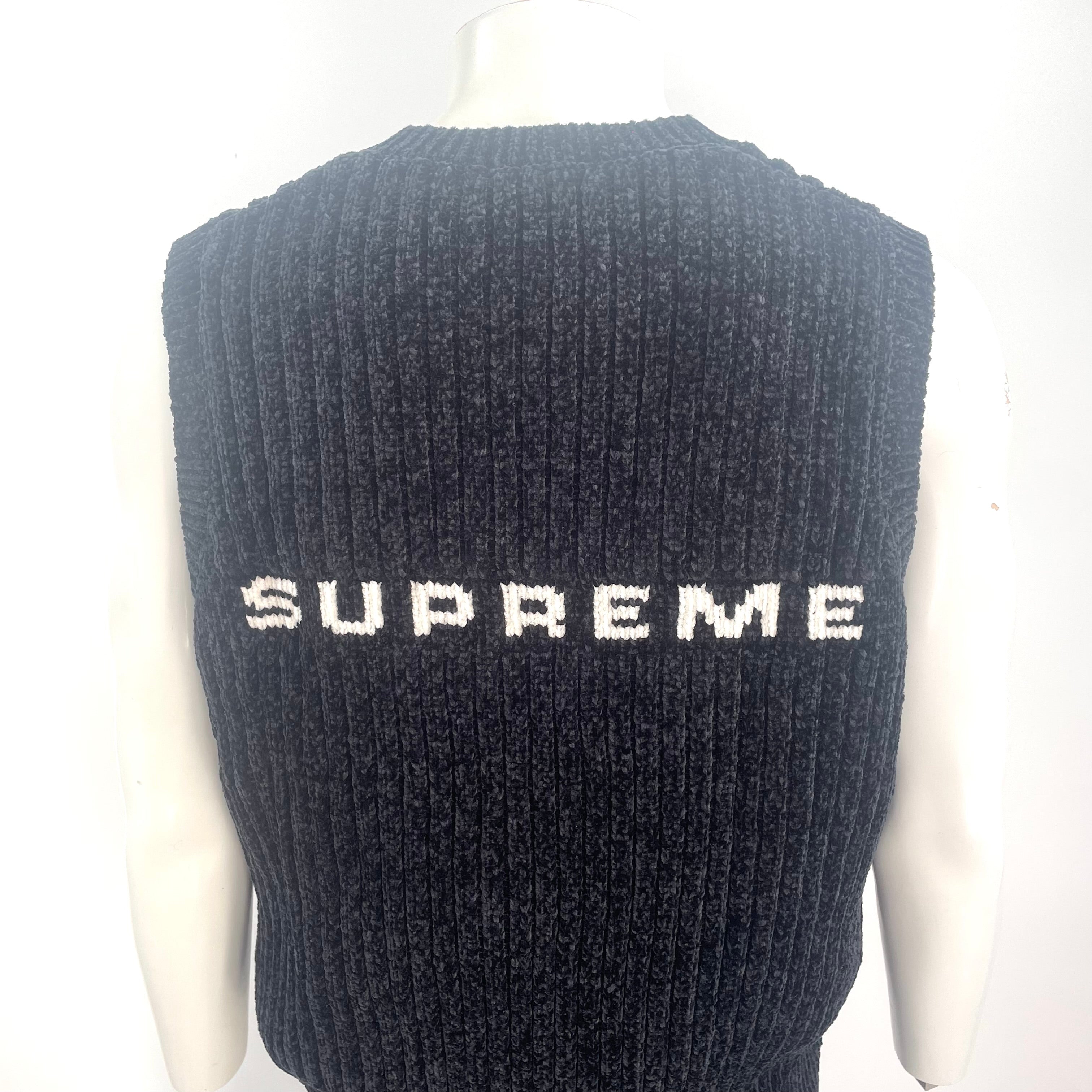 The Supreme Exquisite Chenille Knit Sweater Vest Black is a premium knit vest made from soft chenille fabric for a textured,