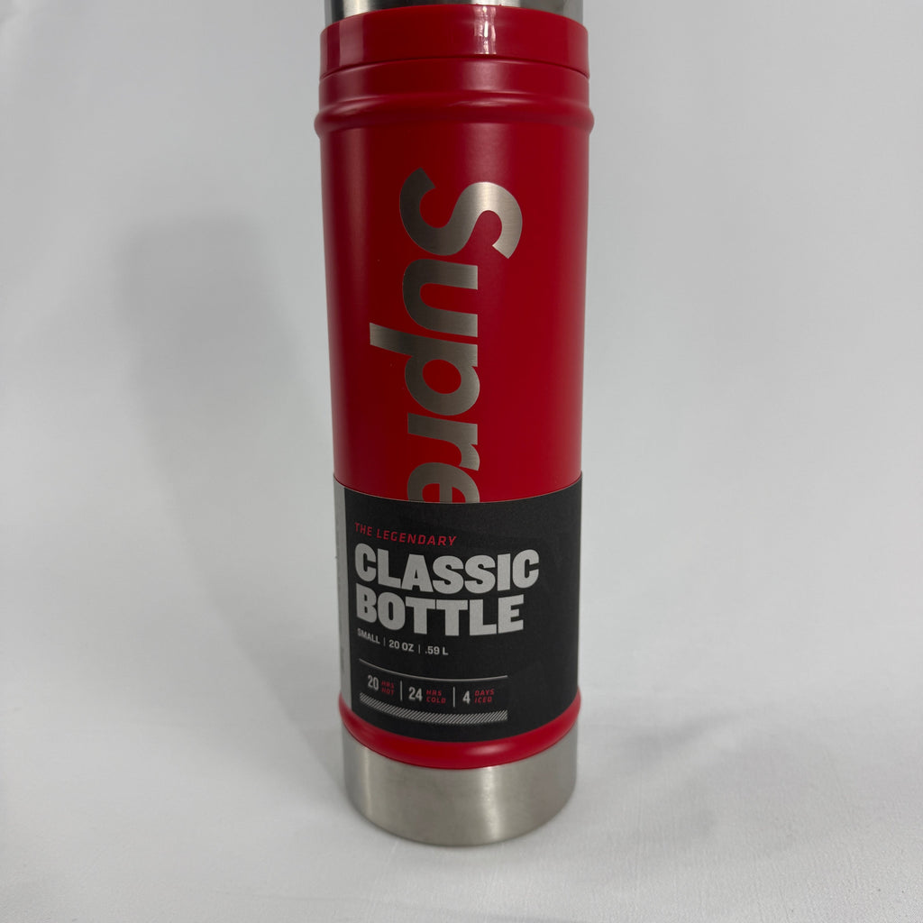 Supreme Classic Water Bottle in red, featuring bold Supreme branding on a compact 0.59L ( 20oz) bottle. A practical everyday