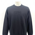 Supreme Cutout Logo Crewneck Sweatshirt in black, featuring a subtle tonal Supreme logo detail on the chest. A clean and