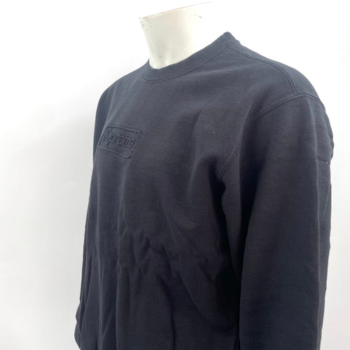 Supreme Cutout Logo Crewneck Sweatshirt in black, featuring a subtle tonal Supreme logo detail on the chest. A clean and