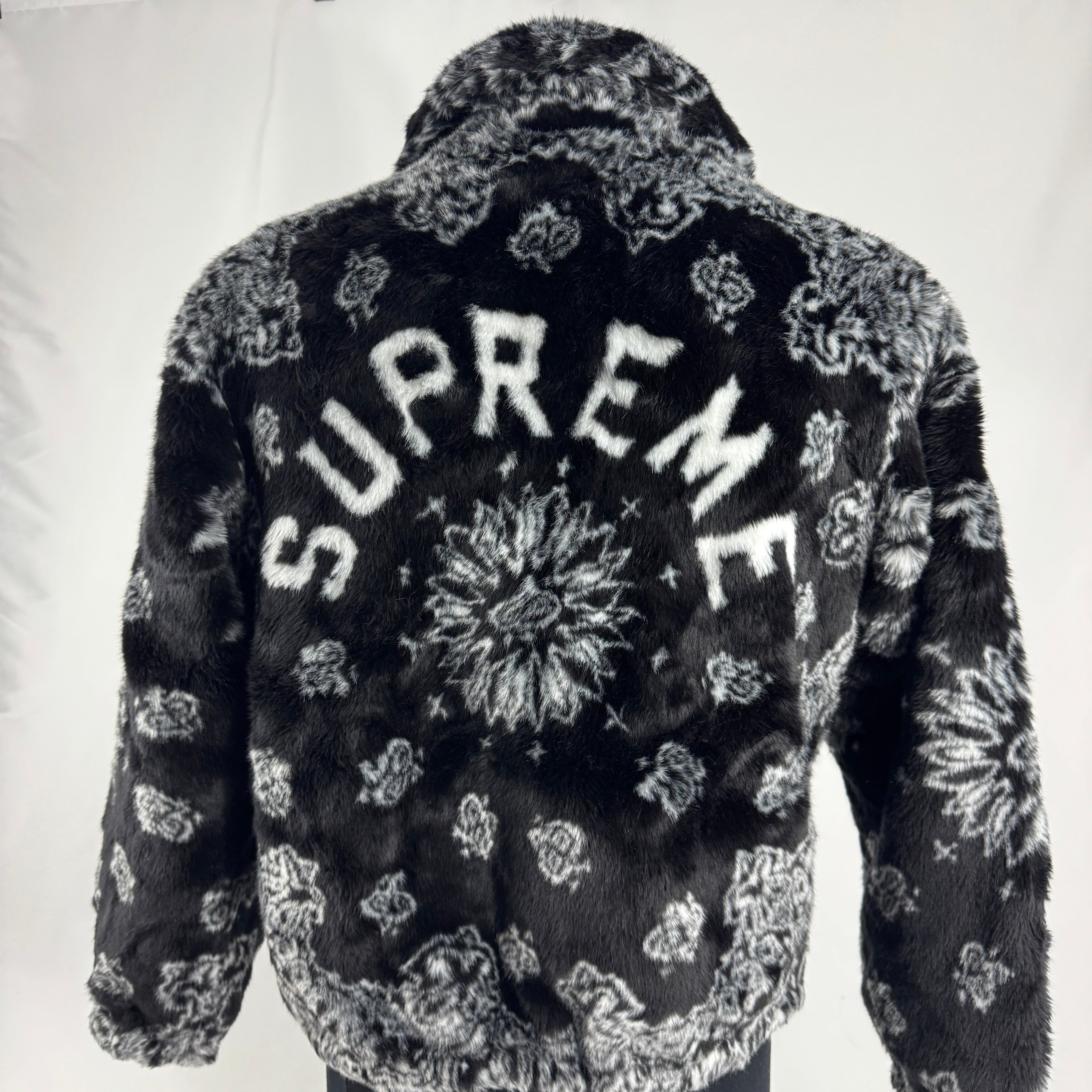 The Supreme Faux Fur Zip-Up Jacket is a heavyweight streetwear piece made with a faux fur outer shell and a full zip front.