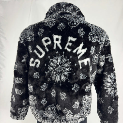 The Supreme Faux Fur Zip-Up Jacket is a heavyweight streetwear piece made with a faux fur outer shell and a full zip front.