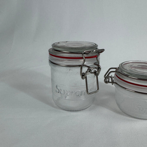 Plain glass jars with SUPREME branding (see-through)