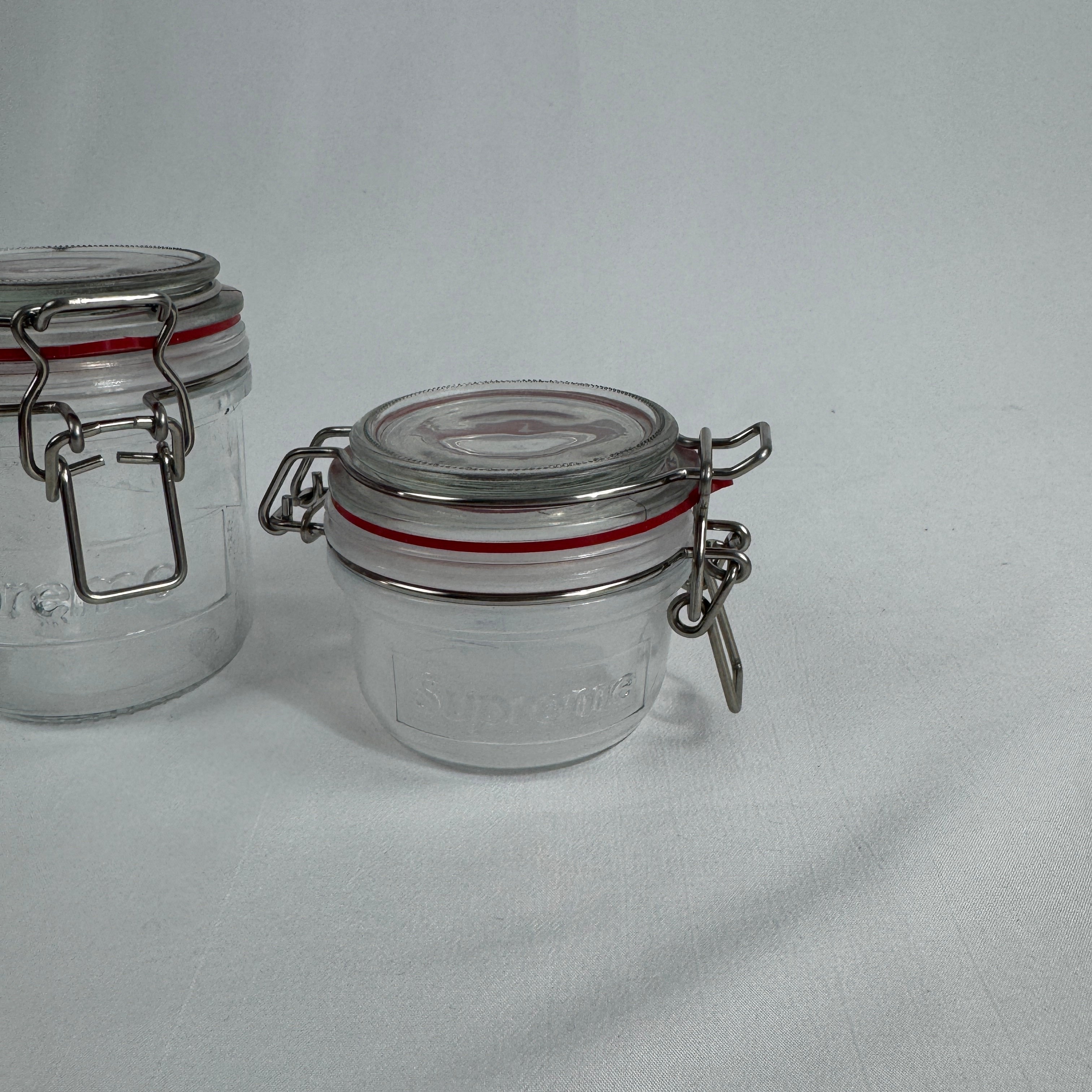 Plain glass jars with SUPREME branding (see-through)