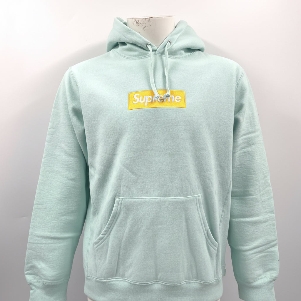 The Supreme Gold Box Logo Hoodie Ice Blue is a heavyweight cotton hoodie featuring the iconic Supreme Box Logo embroidered