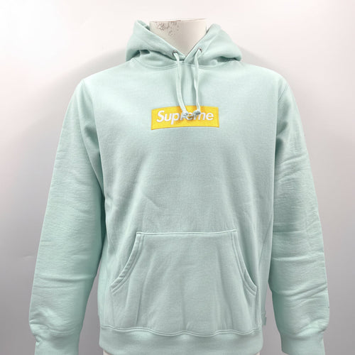 The Supreme Gold Box Logo Hoodie Ice Blue is a heavyweight cotton hoodie featuring the iconic Supreme Box Logo embroidered