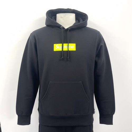 The Supreme Neon Box Logo Hoodie Black is a premium heavyweight cotton hoodie featuring the iconic box logo with a