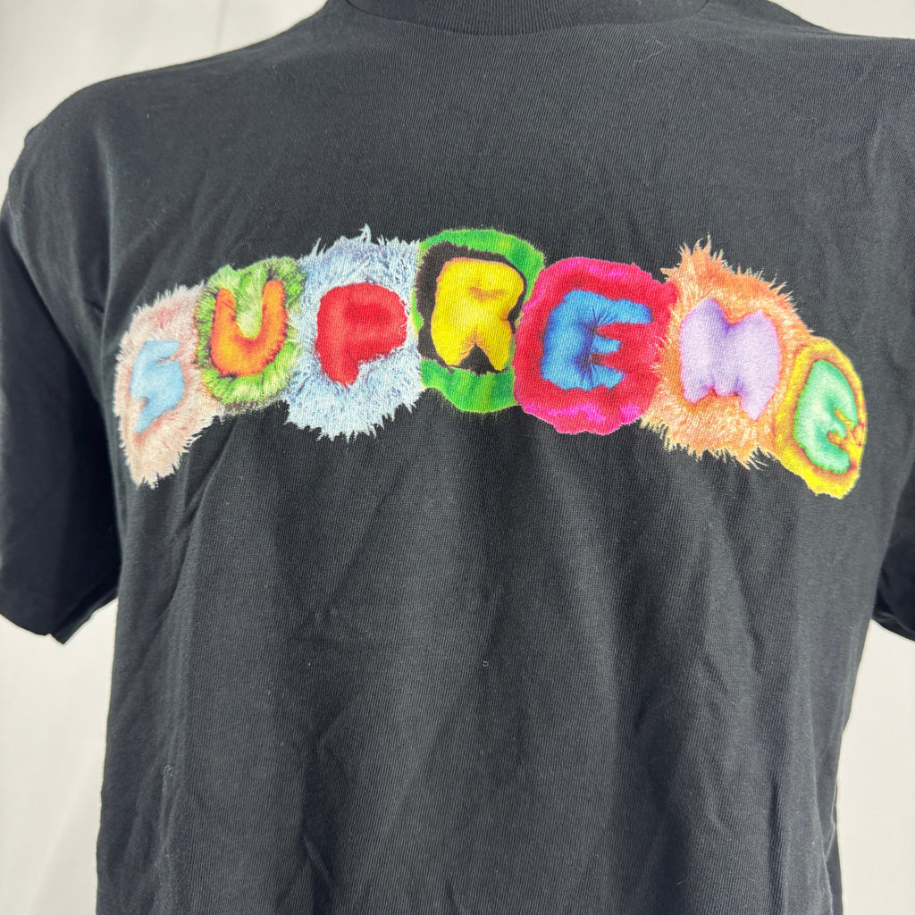 The Supreme Pillows Tee is a classic cotton T-shirt featuring a graphic inspired by the American rock band The Pillows. It