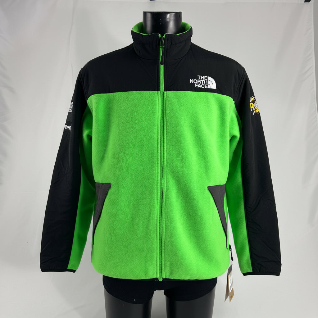 The Supreme x The North Face RTG Fleece Jacket is a collaborative outerwear piece made from warm, soft fleece with durable