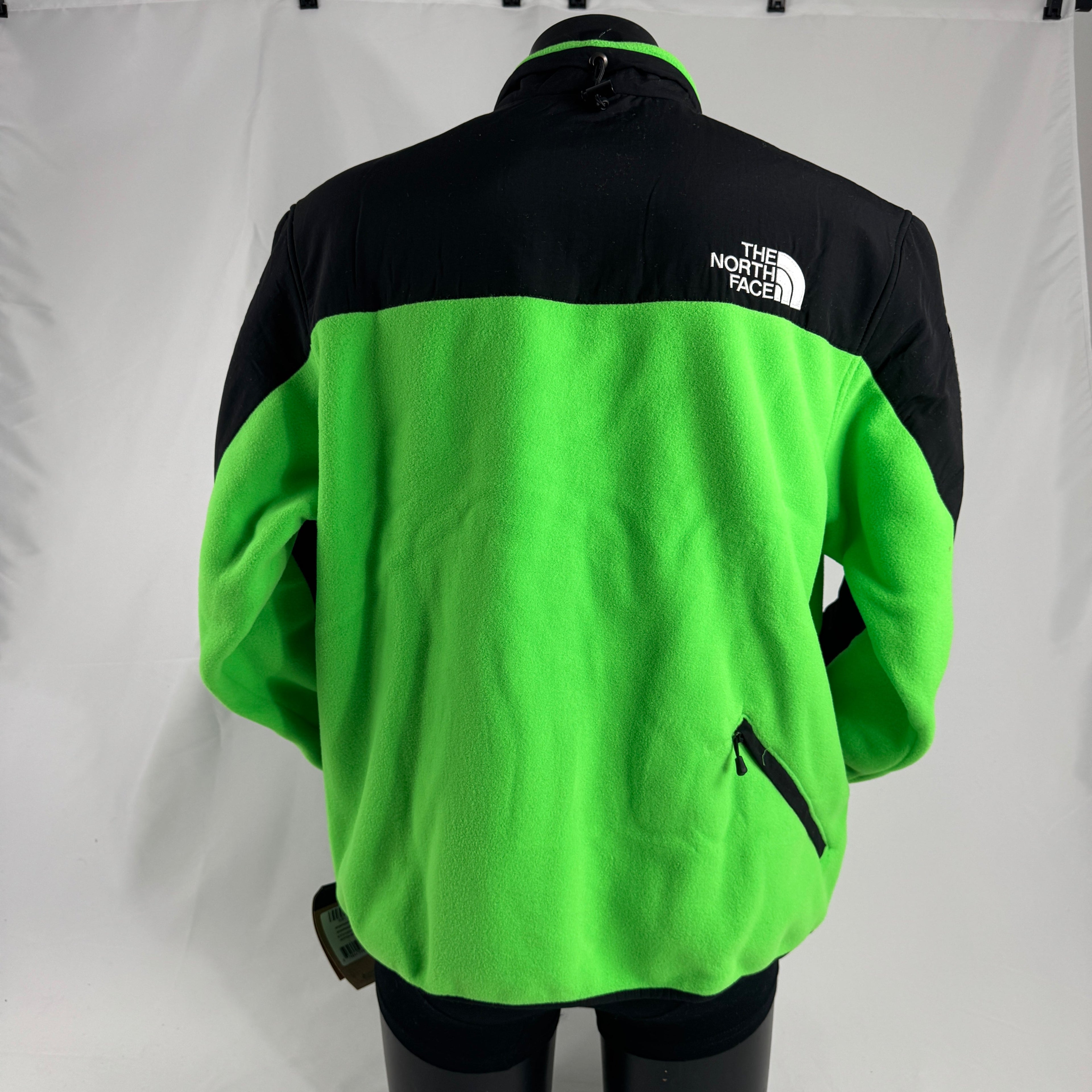 The Supreme x The North Face RTG Fleece Jacket is a collaborative outerwear piece made from warm, soft fleece with durable