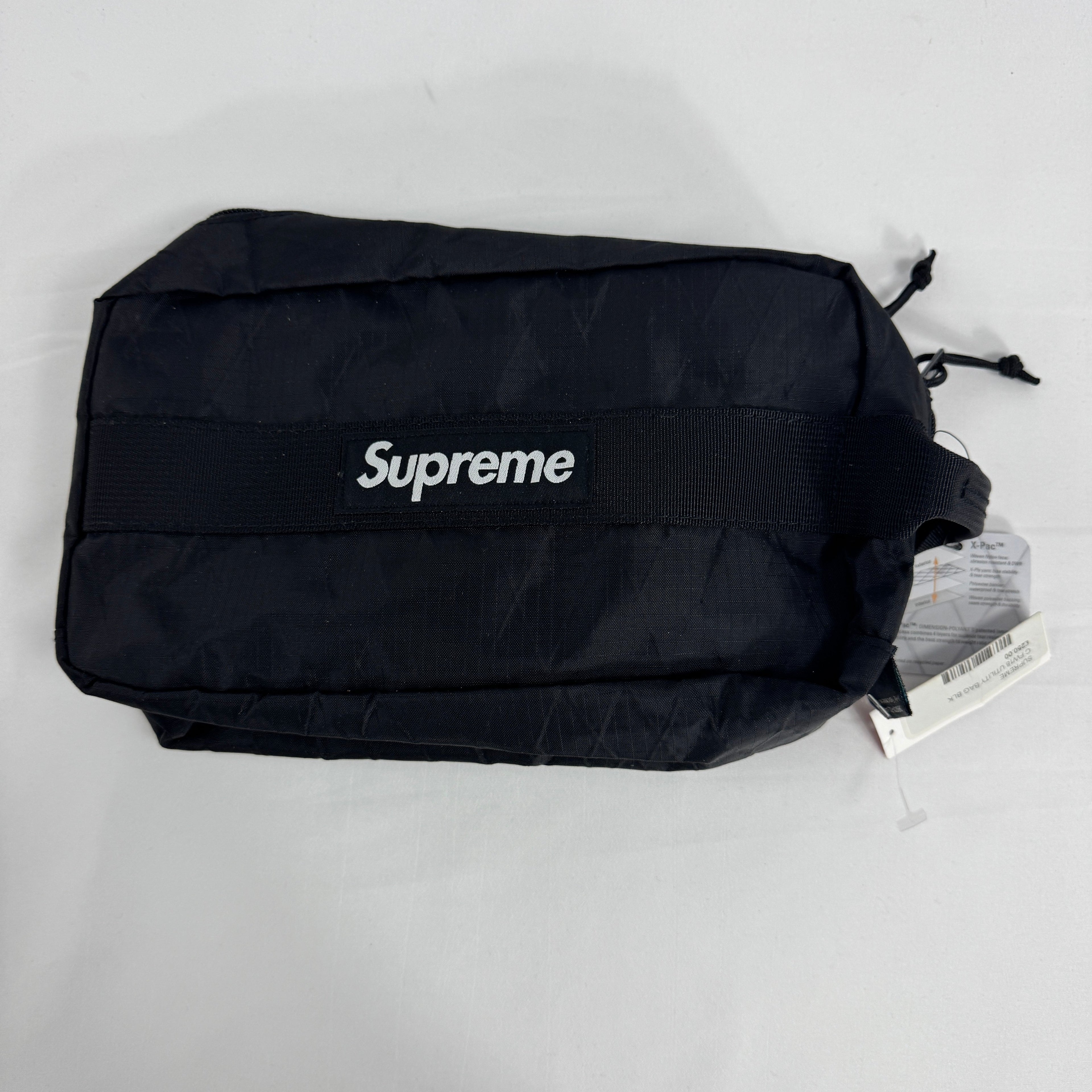 The Supreme Toiletry Bag Black With See-Through Front is a compact travel pouch made from durable material with a clear