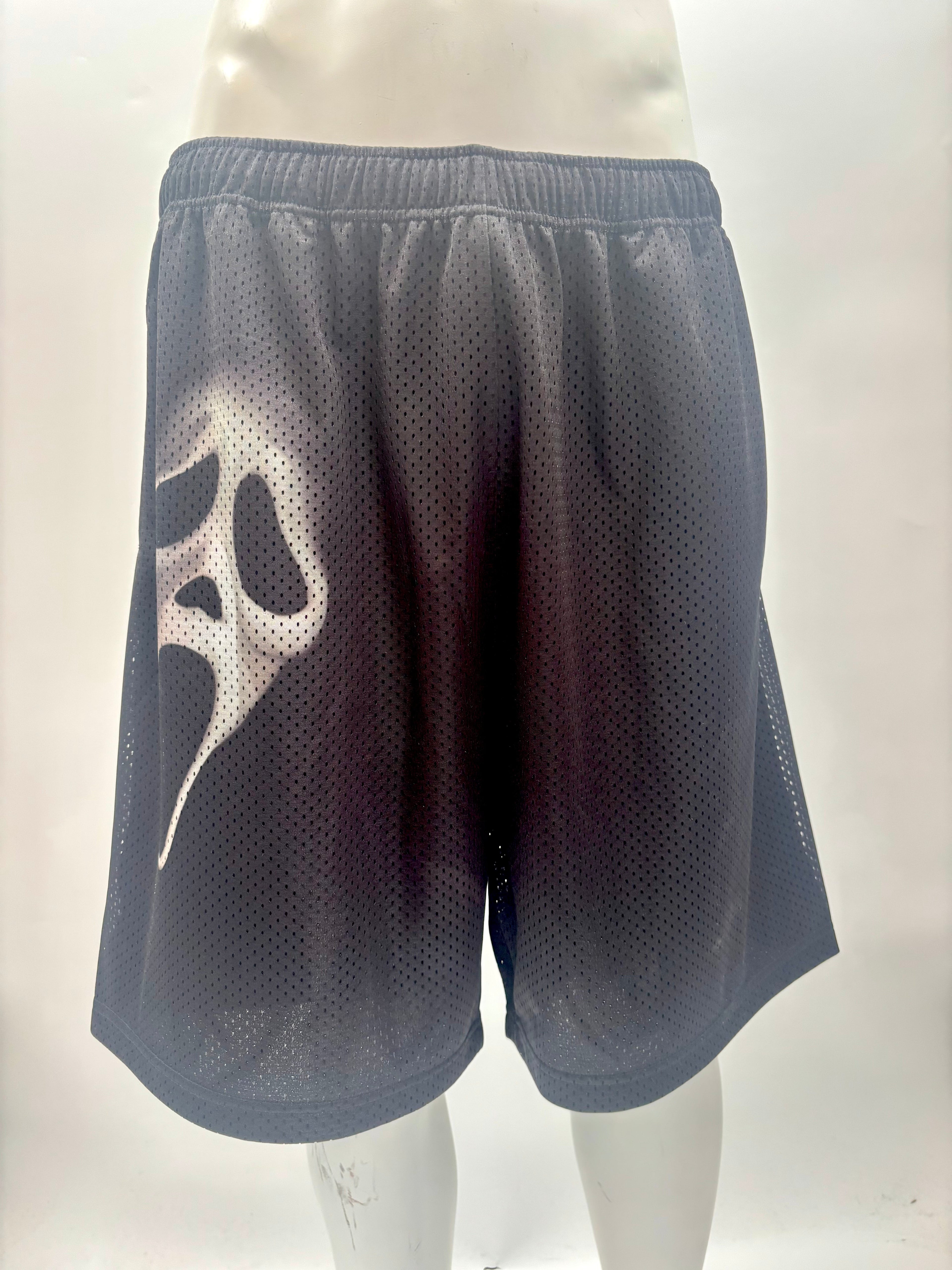 Black Supreme shorts with a white ghost face graphic, breathable mesh fabric and elastic waistband, displayed on a mannequin.
