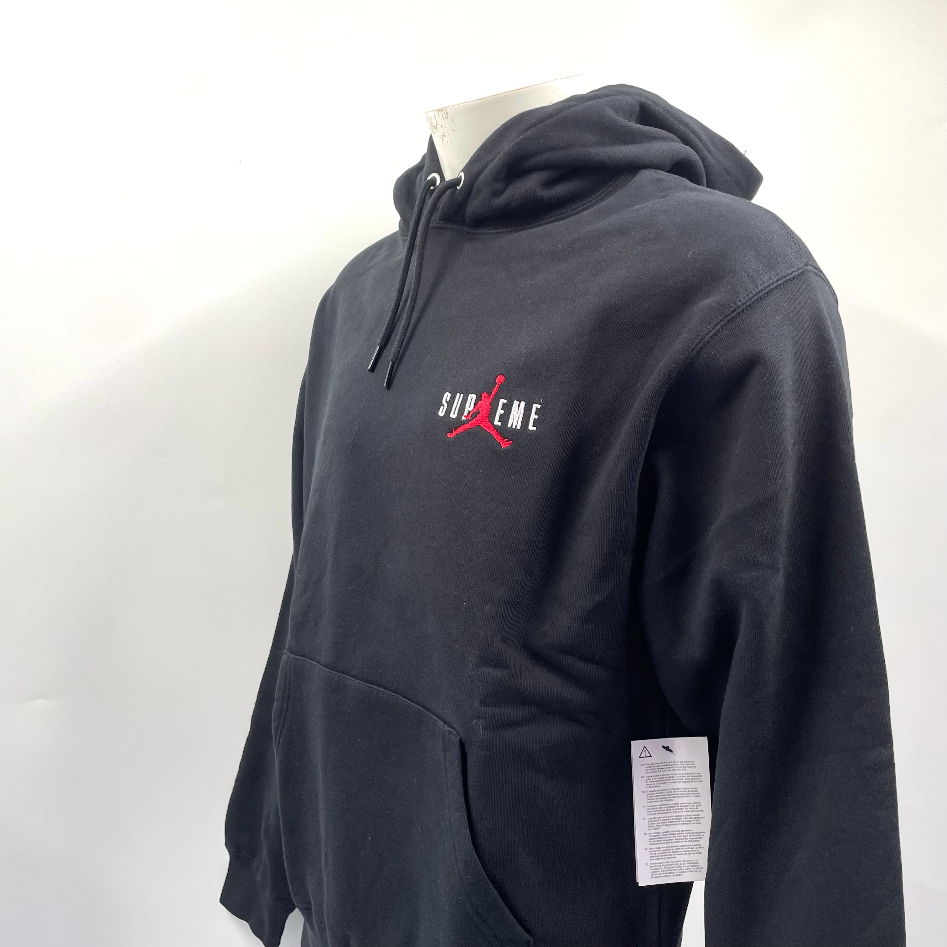 A standout Supreme x Jordan black hoodie with embroidered front branding, bold rear Jumpman logo, drawstring hood and