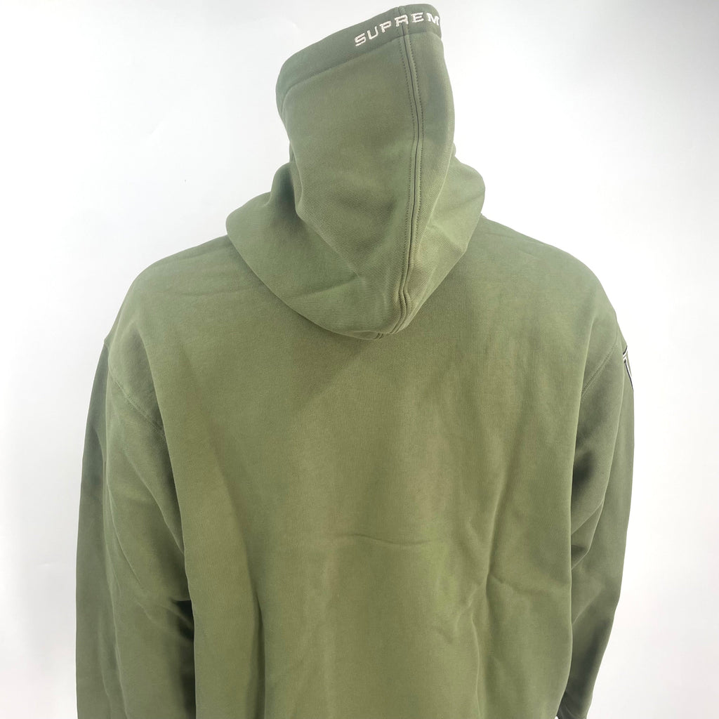 The Jordan x Supreme Collaboration Hoodie Khaki Green is a premium streetwear hoodie that combines Jordan Brand’s athletic