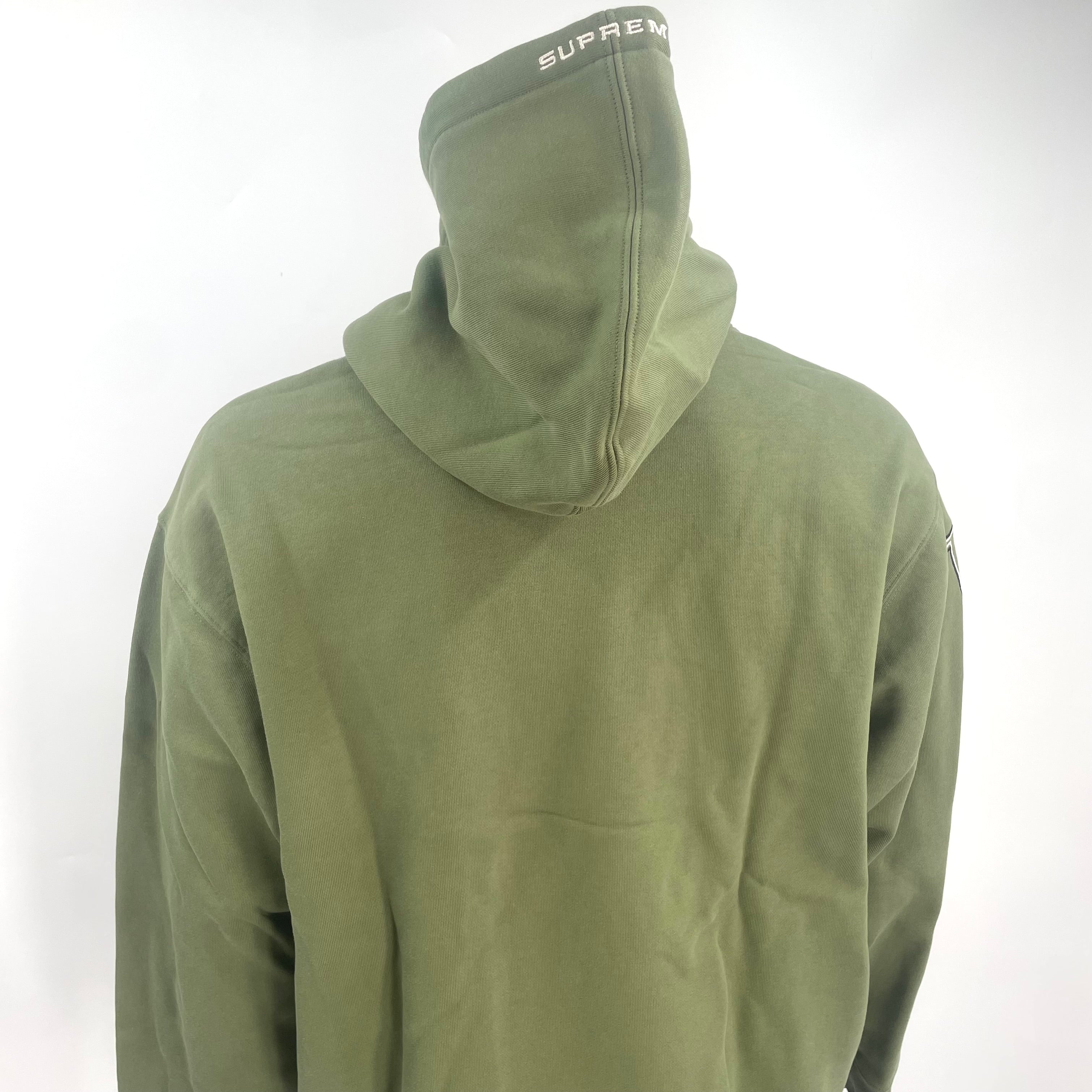 The Jordan x Supreme Collaboration Hoodie Khaki Green is a premium streetwear hoodie that combines Jordan Brand’s athletic