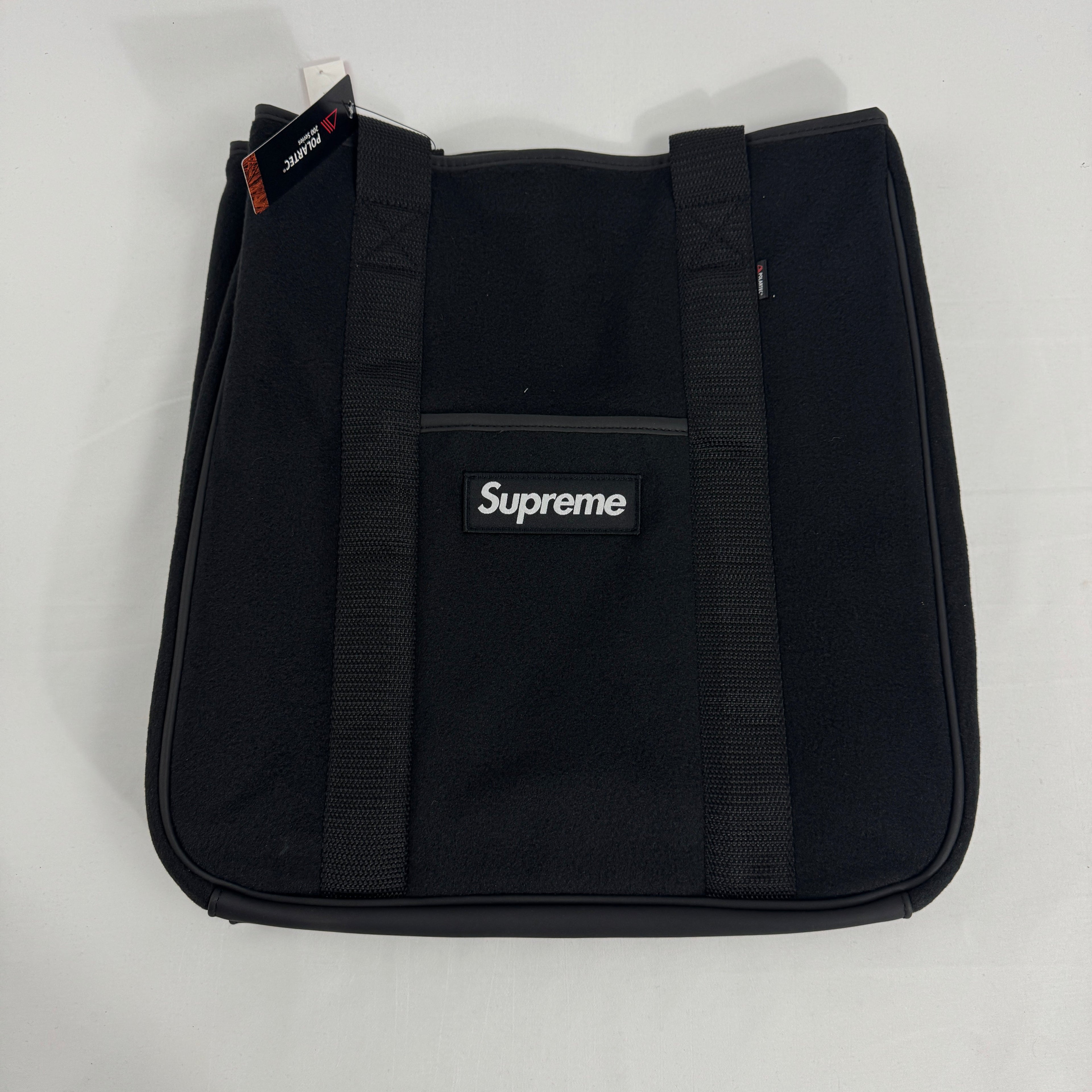 The Supreme x Polartec Tote Bag is a versatile carryall made from soft, durable Polartec fleece for a distinctive textured