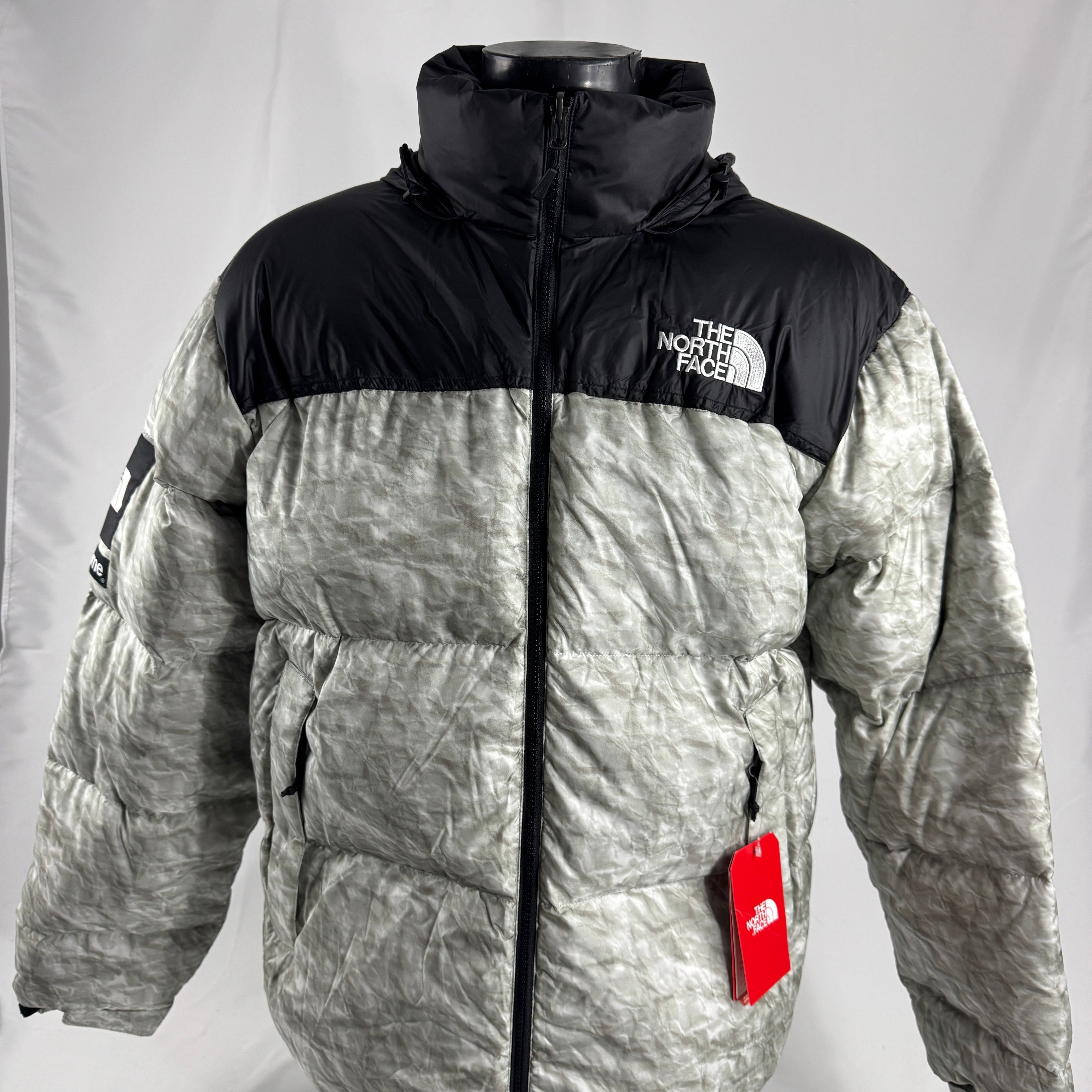 The Supreme x The North Face Nuptse is a collaborative version of The North Face’s iconic down jacket, combining the classic