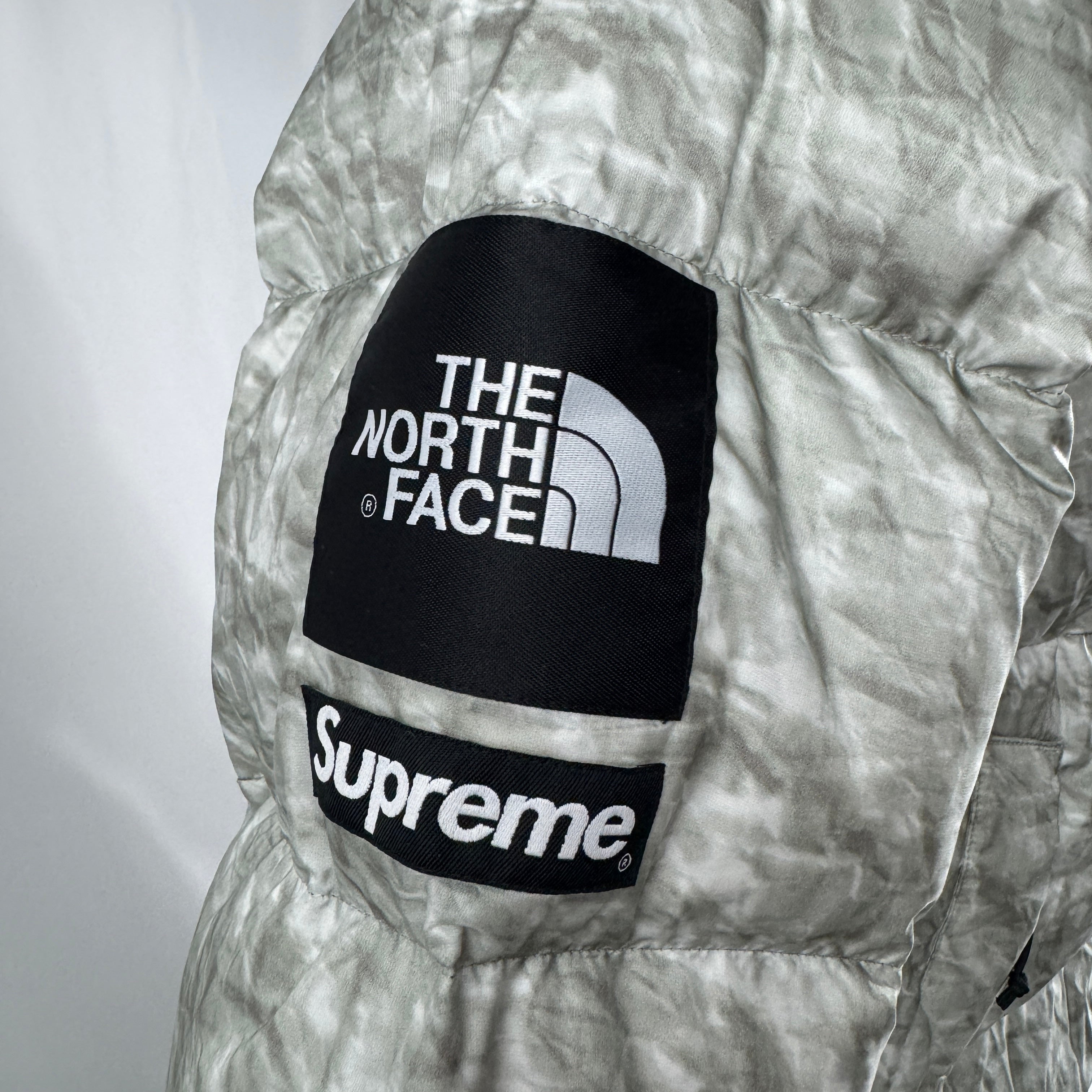 The Supreme x The North Face Nuptse is a collaborative version of The North Face’s iconic down jacket, combining the classic