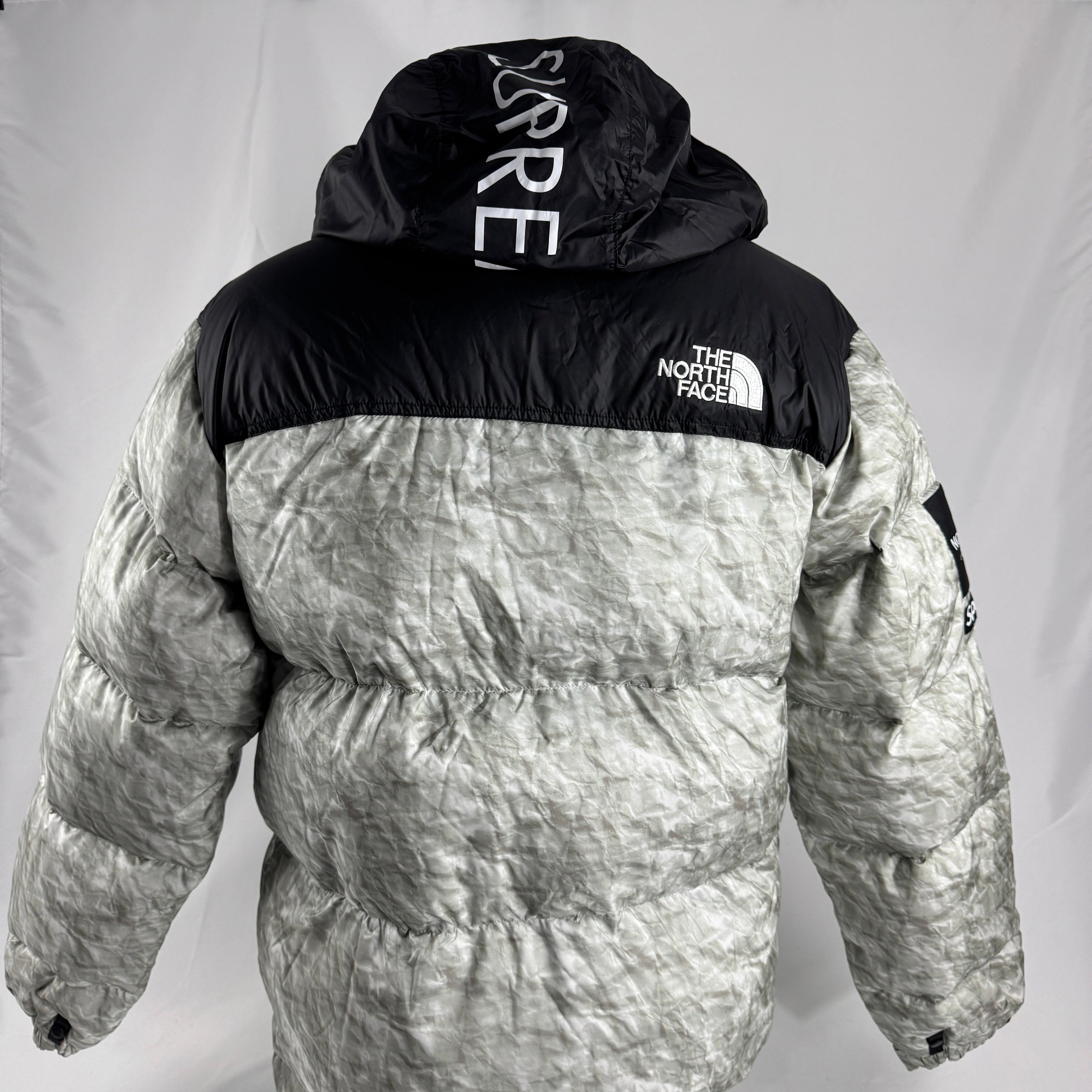 The Supreme x The North Face Nuptse is a collaborative version of The North Face’s iconic down jacket, combining the classic