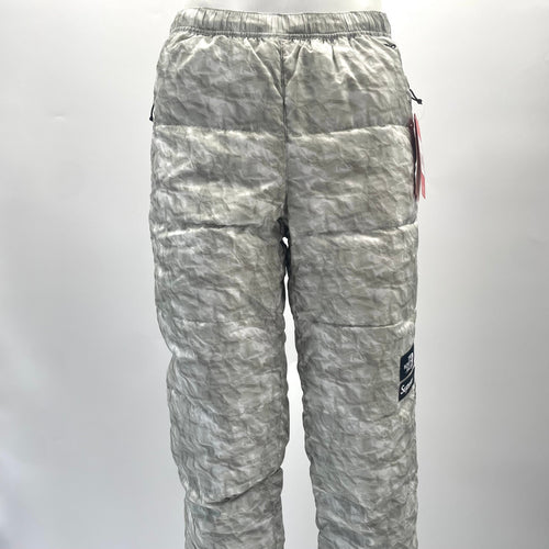 A standout Supreme x The North Face Nuptse pant in the distinctive paper-print design, finished with insulated padding and