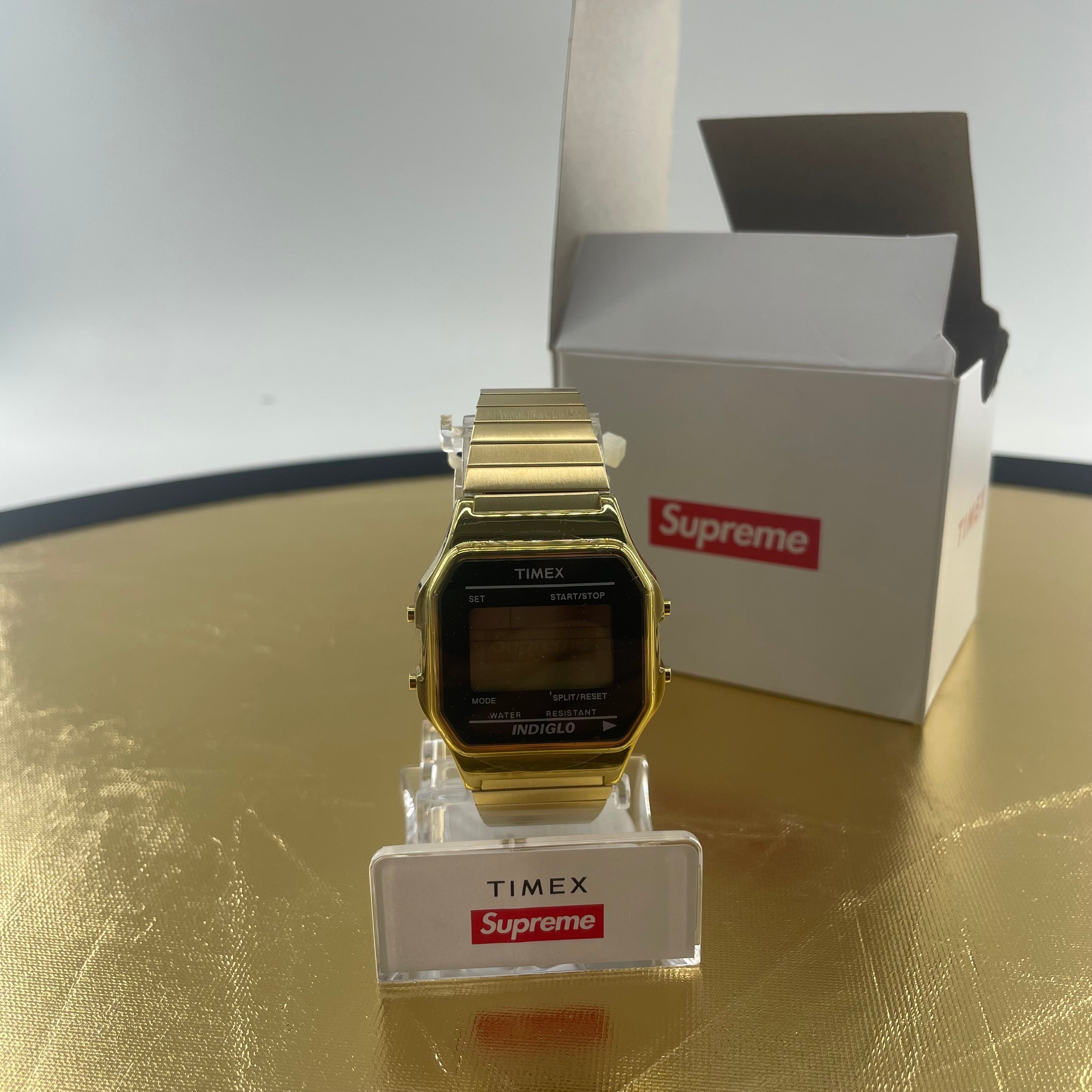 Gold coloured TIMEX X SUPREME wristwatch, brand new.