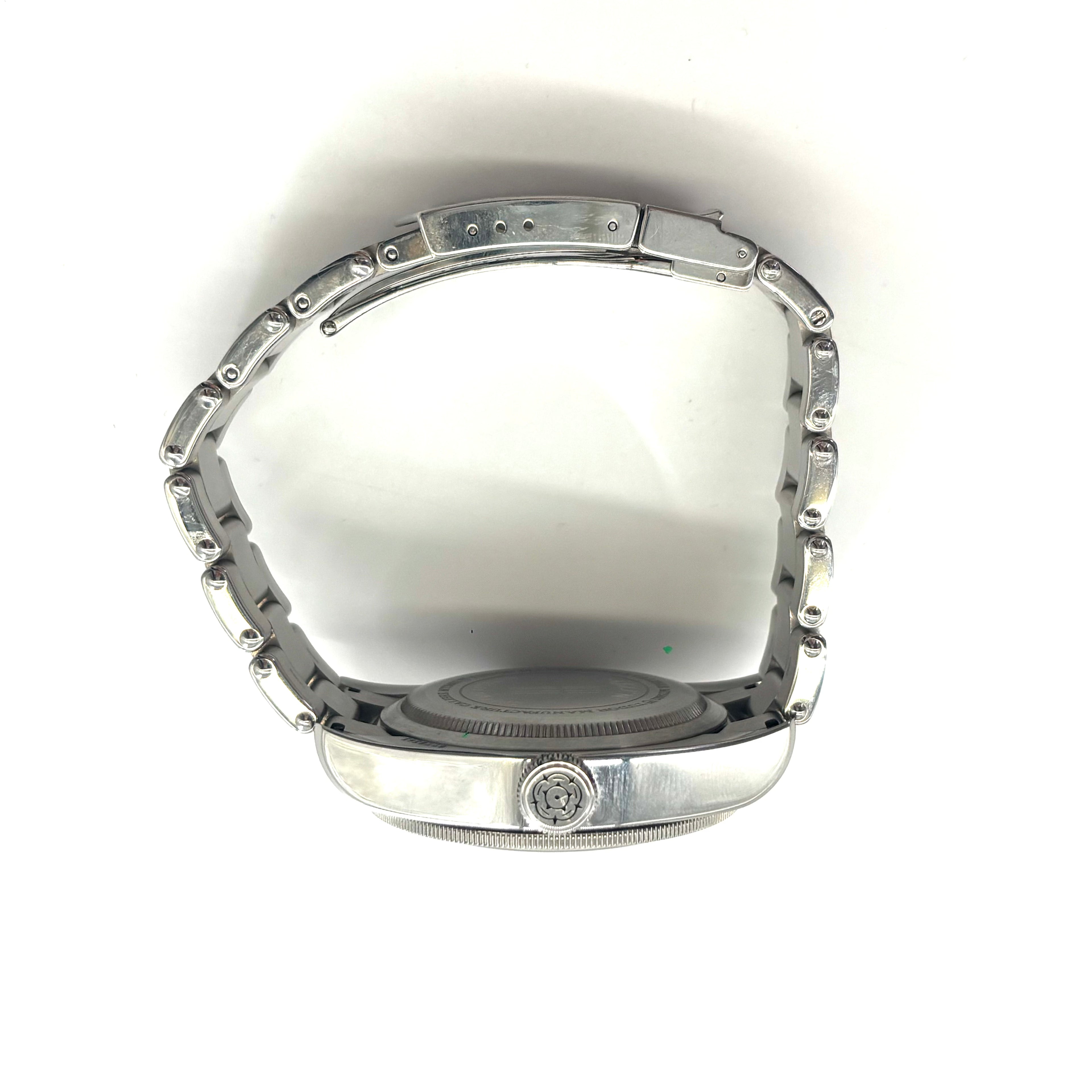 TUDOR Black Bay Harrods wristwatch with a metal strap and black dial shown on its side against a white background.