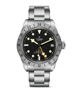 TUDOR Black Bay Pro stainless steel watch with black dial, silver bezel, vintage cream markers, date display and metal bracelet.