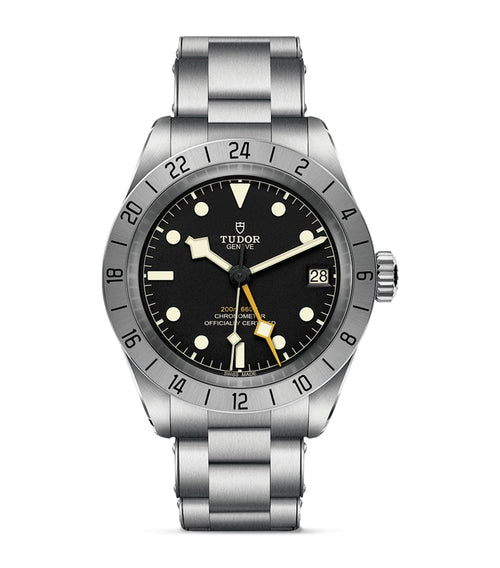 TUDOR Black Bay Pro stainless steel watch with black dial, silver bezel, vintage cream markers, date display and metal bracelet.