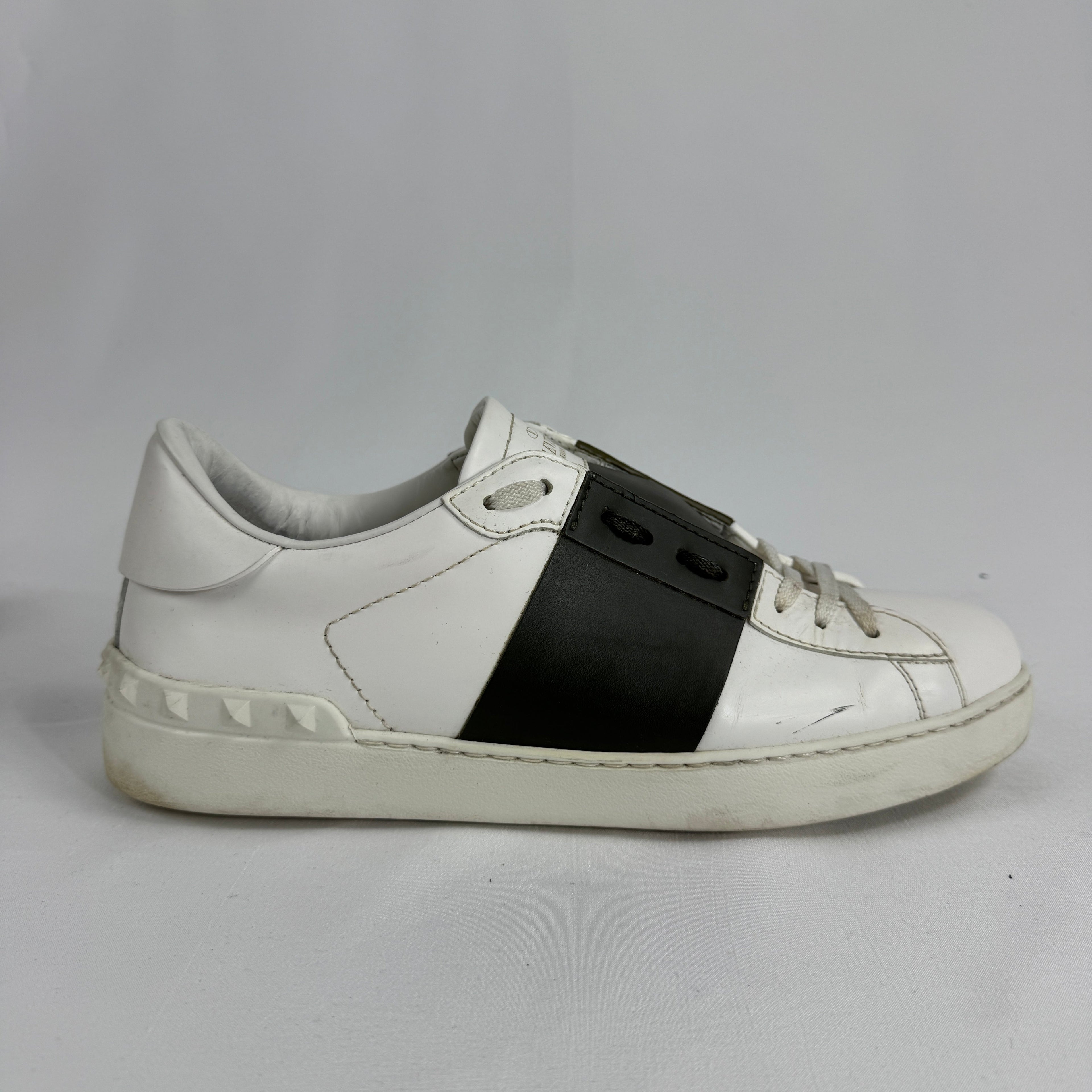 The Valentino Garavani Open Trainers are a refined luxury sneaker known for their clean, minimalist design and premium