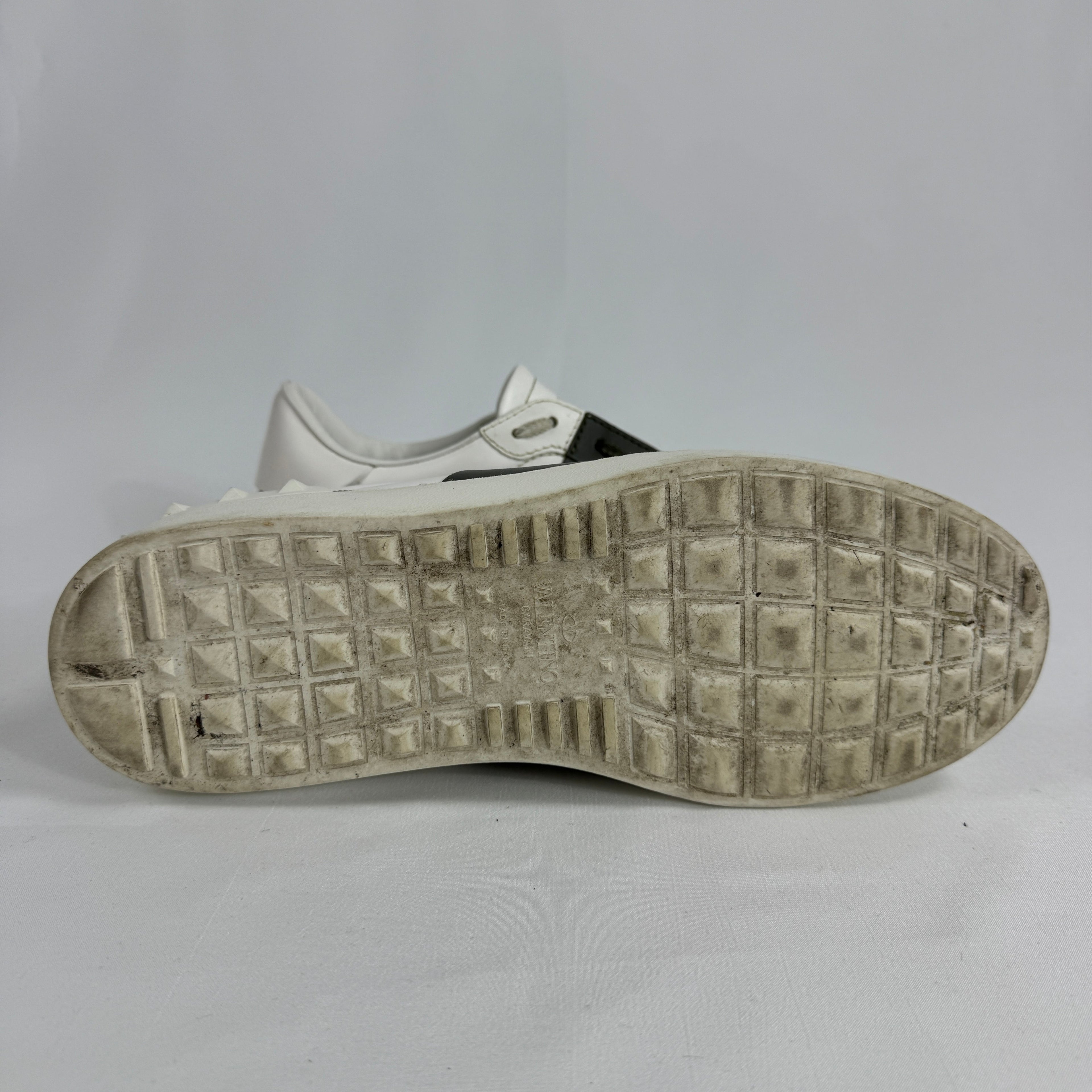 The Valentino Garavani Open Trainers are a refined luxury sneaker known for their clean, minimalist design and premium