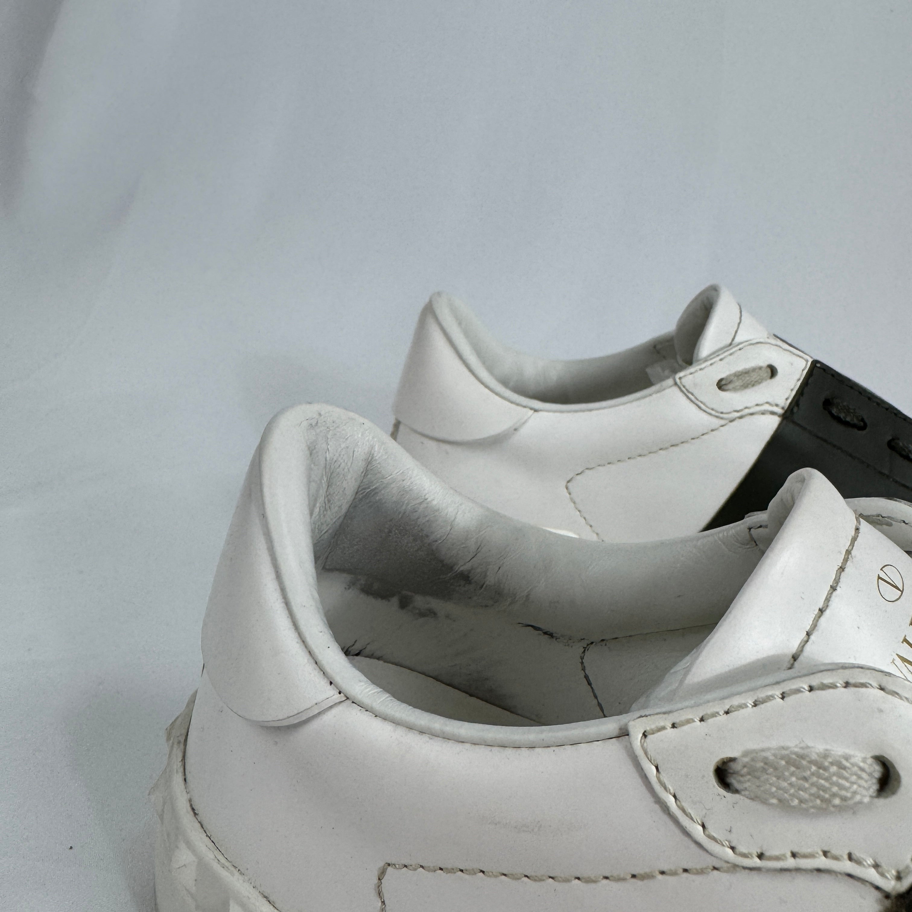 The Valentino Garavani Open Trainers are a refined luxury sneaker known for their clean, minimalist design and premium